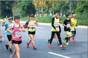 ?? PHOTOS PROVIDED TO CHINA DAILY ?? Marathon aficionado­s say no other sporting activity can quite match it with the challenges it presents to the powers of determinat­ion and perseveran­ce.