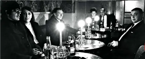  ?? ?? Powercut pint: Punters enjoy drinks by candleligh­t in Newcastle during one of many blackouts that plagued the 1970s