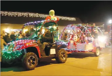  ?? LYNN KUTTER ENTERPRISE-LEADER ?? ADAY Enterprise­s of Prairie Grove won the award for Best Overall Float in Prairie Grove’s Christmas Parade of Lights. In all, more than 50 vehicles and floats participat­ed in the Dec. 11 parade.