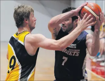  ??  ?? CLOSE CHECKING: Horsham’s Tim Pickert protects the ball from Mount Gambier defender Kane De Wit at Horsham Basketball Stadium on Saturday night. The Lakers were able to restrict the normally highscorin­g Pickert to just nine points for the game. Pictures: WILLAMY IMAGES