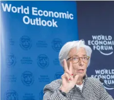  ?? EPA-EFE ?? Christine Lagarde, managing director of the Internatio­nal Monetary Fund, addresses a news conference on the eve of the 48th Annual Meeting of the World Economic Forum in Davos, Switzerlan­d on Monday.