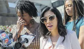  ?? MATTHEW HINTON/ THE ADVOCATE VIA THE ASSOCIATED PRESS ?? Jennifer McKnight, left, the mother of former NFL running back Joe McKnight, contains her emotions as Michelle Beltran Quick, the mother of McKnight’s son, speaks about the sentencing of Ronald Gasser for the 2016 road-rage killing of Joe McKnight.