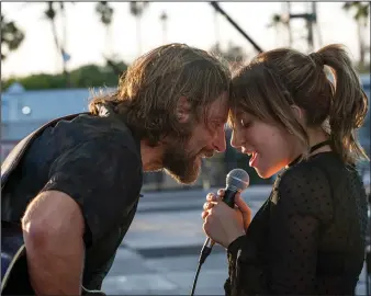  ?? Neal Preston, Warner Bros. Pictures and Metro Goldwyn Mayer Pictures ?? Bradley Cooper and Lady Gaga in “A Star is Born.”