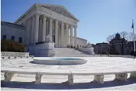  ?? AP Photo/Mariam Zuhaib, File ?? ■ People stand Feb. 11 on the steps of the U.S. Supreme Court in Washington.