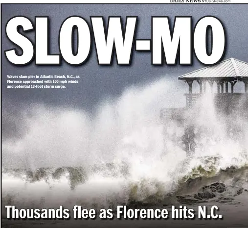  ??  ?? Waves slam pier in Atlantic Beach, N.C., as Florence approached with 100 mph winds and potential 13-foot storm surge.