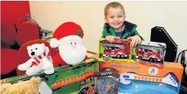  ??  ?? Toys are us Three year-old Olly Morton is supporting Give a Gift