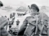  ??  ?? On the beaches: the piper of the story Bill Millin, main, surrounded by troops; above, the commandos land on Sword Beach with Lord Lovat in the water to the right of the column of men; below, Stan ‘Scottie’ Scott