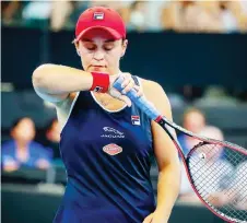  ?? — AFP photo ?? Barty reacts after a point against Jennifer Brady of the US.