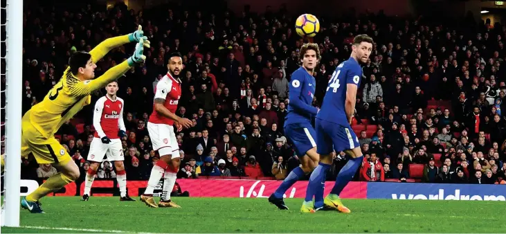  ?? BPI/REX ?? Level best: Hector Bellerin (far right) fires a half-volley into the top corner for Arsenal’s injury-time equaliser