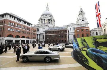  ??  ?? Models of cars by luxury British sports car manufactur­er Aston Martin are parked outside the London Stock Exchange in London as the company is floated on the market. — AFP photo