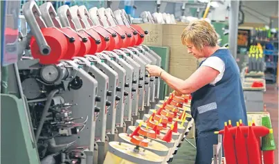  ??  ?? A technician oversees the yarn spinning process at Todd & Duncan’s Lochleven Mills at Kinross.