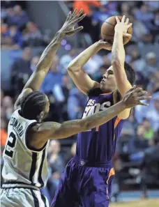  ?? JOS MNDEZ, EFE-USA TODAY SPORTS ?? “We finally finished out a big game tonight,” Devin Booker, right, said after leading the Suns past the Spurs on Saturday.