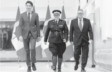  ??  ?? Brenda Lucki, Prime Minister Justin Trudeau and Ralph Goodale, minister of public safety and emergency preparedne­ss at RCMP “Depot” Division in Regina. Lucki, who was Depot's commanding officer, was appointed Canada's first permanent female RCMP...