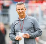  ?? Jay LaPrete / Associated Press ?? Ohio State coach Urban Meyer was placedon paid administra­tive leave while the university investigat­es claims his wife knew about allegation­s of abuse against an assistant coach years before he was fired last week.