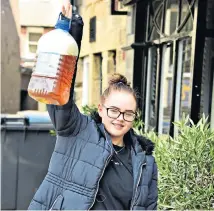  ??  ?? Ale in a good cause Abbiegale Carr with beer from the Alnwick Brewery in Northumber­land, which is giving away unused stock in return for donations to the NHS.