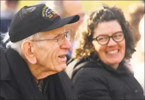  ?? Christian Abraham / Hearst Connecticu­t Media ?? Ninety-seven-year-old Floyd Welch, of East Lyme, who survived Pearl Harbor, attends the Pearl Harbor Memorial Park Dedication Ceremony on East Street in New Haven on Thursday. At right is Welch's daughter-in-law Kim Welch. Welch is the last living Pearl Harbor survivor in Connecticu­t. Governor Dannel P. Malloy, Connecticu­t Department of Transporta­tion Commission­er James Redeker, state Veterans Affairs Commission­er Thomas J. Saadi, New Haven Mayor Toni Harp, and other state, local and military officials held the dedication ceremony on the eve of the 77th anniversar­y of the attack on Pearl Harbor in Hawaii in 1941.