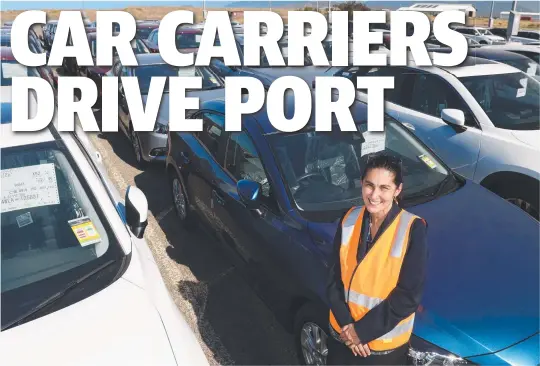  ?? BOOM TIME: Port of Townsville Ltd’s acting general manager business developmen­t Maria James surrounded by just some of the 4500 cars that have arrived here since July 1 — an increase of 40 per cent over the same period last year. Picture: WESLEY MONTS ??