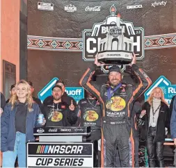  ?? ASHLEY LANDIS/AP ?? NASCAR Cup Series driver Martin Truex Jr. celebrates Sunday after winning an exhibition race at Los Angeles Memorial Coliseum.