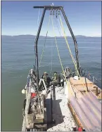  ?? PHOTOS COURTESY JANET WATT — USGS ?? Researcher­s aboard the USGS research barge “Retriever” in October 2016perfor­m coring operations along the Hayward Fault where it runs under San Pablo Bay.