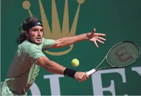  ?? AP ?? Stefanos Tsitsipas hits a backhand to Alejandro Davidovich Fokina during the Monte Carlo Masters final on Sunday.