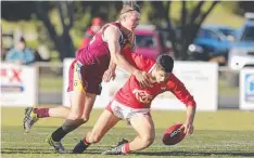  ??  ?? Newcomb’s Jack Hudson tackles Ocean Grove’s James Linton.