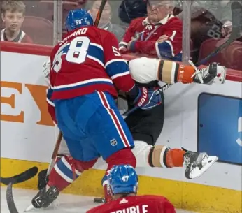  ?? Christine Muschi/Canadian Press ?? Montrea’s David Savard, left, upends Anaheim’s Max Jones on Tuesday night in Montreal.