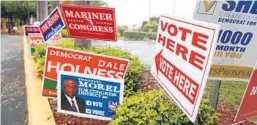  ?? CARLINE JEAN/SOUTH FLORIDA SUN SENTINEL ?? Campaign signs outnumbere­d voters at the early voting site at the African American Research Library and Cultural Center in Fort Lauderdale on Monday. Voters are deciding who will fill the vacancy created by the death of longtime Congressma­n Alcee Hastings.