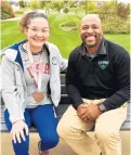  ?? ?? Zoe Voris sits next to her former coach, Keith Wallace, executive director of the Lincolnway Special Recreation Associatio­n.