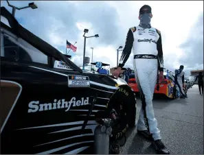  ?? PHOTO BY SEAN GARDNER/GETTY IMAGES ?? Aric Almirola waits on the grid prior to the Dixie Vodka 400 at Homestead-Miami Speedway on Feb. in Homestead, Fla.