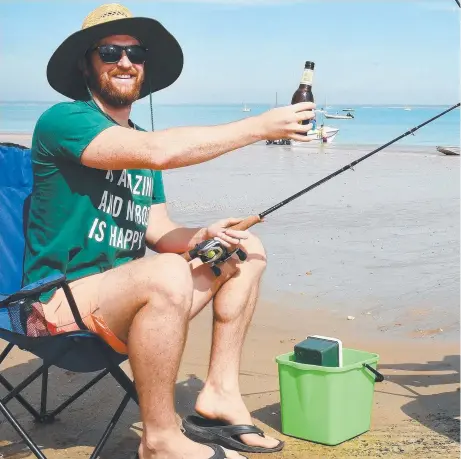  ?? Picture: KATRINA BRIDGEFORD ?? Top End angler Russell Smith hopes his relaxed attitude will help calm the fish and increase his catch