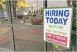  ?? TED S. WARREN/AP ?? A help-wanted sign at a grocery store in Olympia, Wash., last month.