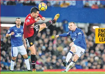  ??  ?? Everton's Wayne Rooney (R) shot is blocked by Manchester United's Ander Herrera during the English Premier League football match at Goodison Park in Liverpool.