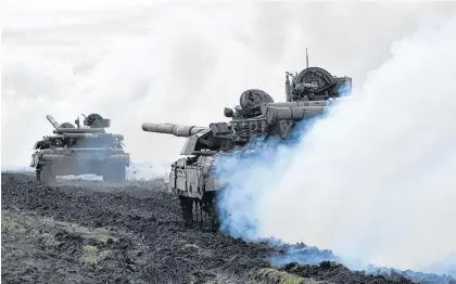  ?? REUTERS ?? Tanks of the Ukrainian Armed Forces are seen during drills at an unknown location near the border of Russian-annexed Crimea, Ukraine, in this handout picture released by the General Staff of the Armed Forces of Ukraine press service on Wednesday.