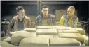  ?? ELECTRONIC ARTS ?? Tyson Latchford, from left, Nick Mendoza and Marcus “Boomer” Boone find a cache of cocaine in “Battlefiel­d Hardline.”
