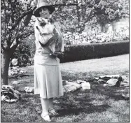  ?? (Library of Congress Prints and Photograph­s Division) ?? First lady Grace Coolidge holds the first family’s pet raccoon in April 1927.