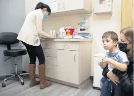  ?? EMMA H. TOBIN/AP ?? Ilana Diener and son Hudson, 3, participat­e in a Moderna vaccine trial last November in Commack, New York.