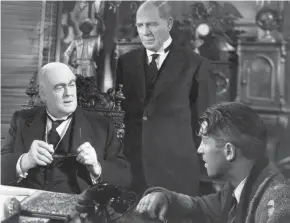  ?? PHIL STERN/PARAMOUNT PICTURES ?? Mr. Potter (Lionel Barrymore), left, looks down on George Bailey (Jimmy Stewart), right, in a scene from the 1946 Frank Capra classic, “It's a Wonderful Life.”