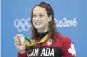  ?? LUCAS OLENIUK/TORONTO STAR ?? Toronto’s Penny Oleksiak shows off the silver medal she won Sunday night in the 100-metre butterfly.