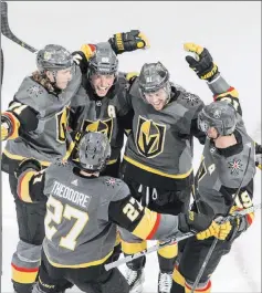  ?? Jason Franson The Associated Press ?? Golden Knights players celebrate a goal Aug. 3 in Edmonton, Alberta.