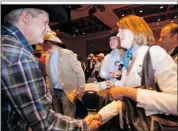  ??  ?? Prime Minister Stephen Harper greets Danielle Smith, now Wildrose leader, at a 2010 Calgary Stampede event.