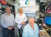  ??  ?? Shirley Spear, Anne Gracie and Rob Ware, interim directors of SkyeConnec­t, sign the contract with Highlands and Islands Enterprise for funding for a project officer.