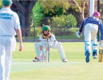  ?? ?? Archer Burgmann takes the stumps as the throw from the field is a direct hit.