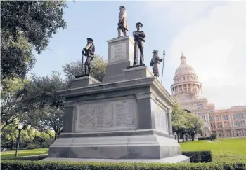  ?? ERIC GAY/AP 2017 ?? One of seven Confederat­e memorials at the Texas Capitol in Austin. The Southern Poverty Law Center counts more than 2,000 Confederat­e symbols, from monuments to names of buildings, in public spaces in the country today.