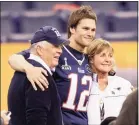  ?? Associated Press file photo ?? Tom Brady, center, poses for a photo with his parents, Tom and Galynn Brady, in 2012. Brady’s parents, who survived COVID-19, are expected to be in attendance for this year’s Super Bowl.