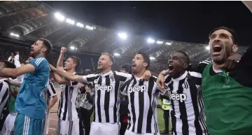  ?? AFP photo ?? Juventus players celebrate at the end of the Italian Serie A match against AS Roma at the Olympic stadium in Rome. —