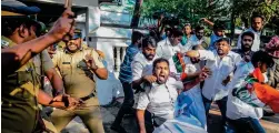  ?? AFP ?? Police beat activists during a protest against women entering the Sabarimala temple, in Kochi, on Thursday. —