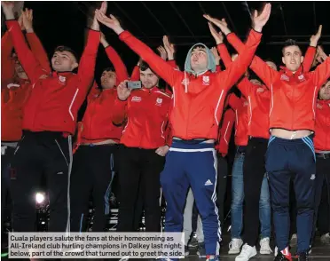  ??  ?? Cuala players salute the fans at their homecoming as All-Ireland club hurling champions in Dalkey last night; below, part of the crowd that turned out to greet the side.