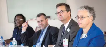  ?? RICH HEIN/SUN-TIMES FILE ?? Then-Cook County Health CEO Dr. John Jay Shannon, second from right, with County Board President Toni Preckwinkl­e, right, and other county officials in 2015.