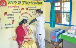  ?? PTI ?? A medic demonstrat­es administra­tion of Covaxin to a health worker during its trials in Assam’s Tezpur on Tuesday