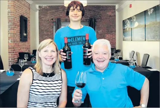  ?? — Photo by Karl Wells/special to The Telegram ?? The joyful Groom family (from left), Lisa, Colby and Daryl enjoying a night out at Magnum and Steins.